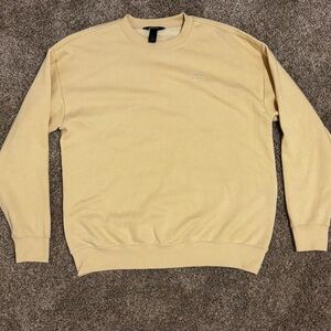 Billabong sweatshirt, size 33 in men’s, has no damages, and light tan color.